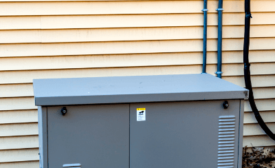 Outdoor generator next to a home