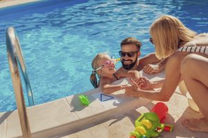 family enjoying pool time